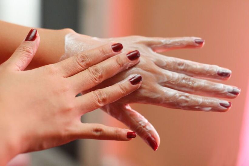 applying cream on the hand to rejuvenate the skin